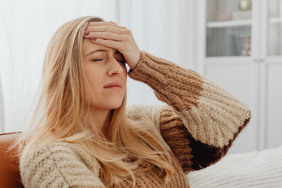 woman sitting on a chair not feeling good